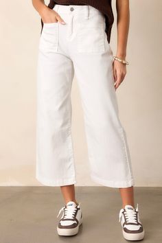 Transform your denim game with our Urban Oasis White Cropped Flare Jeans. These trendy jeans feature a cropped flare silhouette, perfect for showing off your favorite shoes. The clean white color adds a fresh touch to any outfit, making these a must-have for any fashionista's wardrobe. Level up your style game with these quirky and fun jeans! These white jeans feature a high waisted design, a button & zipper closure, belt loops, functional front & back pockets, a cropped hemline, and a flared leg.  65% Cotton, 31% Rayon, 2% Elasterell-poly, 2% Spandex Unlined Machine Wash Cold Manufactured in Vietnam Designed in the USA Model is wearing a size 25 White Cropped Flare Jeans, Fun Jeans, Trendy Jeans, Urban Oasis, Cropped Flare Jeans, Outfit Making, Women's Shapewear, Pajama Bottoms, Swimwear Sale