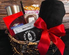 a gift basket filled with coffee, snacks and other items for someone's special occasion