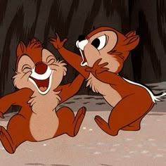 two cartoon characters are dancing together in the woods