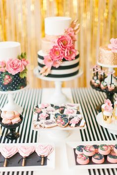 an image of a birthday party with pink flowers and black and white striped table cloth