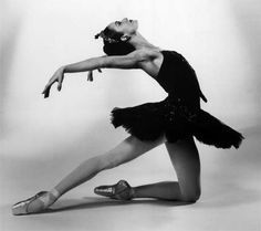 a black and white photo of a ballerina