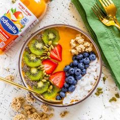 a bowl filled with fruit, cereal and yogurt