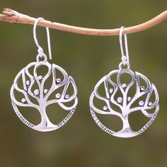 Crafted of sterling silver two trees cradle petite fruits in their branches. Balinese artisan Yus Swarmana designs this pair of dangle earrings which features fantastic openwork patterns. Two Trees, Silver Dangle Earrings, Sterling Silver Dangle Earrings, Silver Work, Balinese, Silver Earrings Dangle, Jewelry Packaging, Elegant Earrings, Hook Earrings