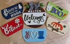 there are many different magnets on the bed together, including one that says welcome to melon