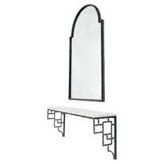 a mirror and bench are shown against a white background, with the reflection of an arch in the mirror