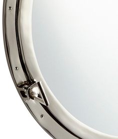 a close up of a mirror on a white background with clippings to the side