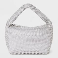 Add shine and glamor to your looks with the Crystal Mesh Handbag from A New Day™. This silver handbag features a mesh design accented with crystals to elevate the look. It is designed with a main compartment and a zippered inner pocket to help keep your cellphone and cards separate. Boasting a lightweight construction, this handbag allows convenient carrying with the single strap. A New Day™: Style that goes wherever you do. Crystal Handbag, Glam Gifts, Silver Handbag, Mini Bows, Mesh Design, A New Day, Clutch Handbag, Handbag Accessories, New Day