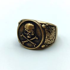 The signet rings are made to order from Italian bronze, silver plated bronze or silver 925 by hand casting. The human skull and crossbones also called Jolly Roger is a famous Pirate symbol. On sides of the ring is depicted Treasure map with compass. This ring is designet as cool ring for men who likes skull jewelry. The ring shipped in wooden jewelry gift box. approximate weight: 19 gm | 0.67 oz Pirate Symbols, Famous Pirates, Hand Casting, Cool Rings For Men, Cool Ring, Treasure Map, Pirate Skull, Biker Rings, Jewelry Men