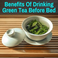 a white bowl filled with green tea sitting on top of a wooden table next to a cup