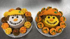 two decorated cupcakes sitting on top of each other