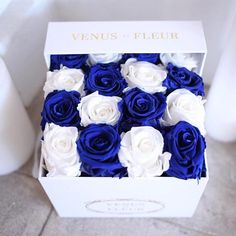 a white and blue box with roses in it