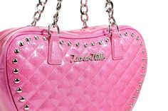 Our fabulous studded heart totes are perfect for day and night. It features studded edges, our Lux de Ville Logo plate, and chain detail on the straps. The inside is lined with our custom black-on-black diamond lining with an inside zipper closure pocket for easy stashing. Enjoy. D: 11H by 14L by 3W Strap Drop: 11 inches Cross Body Strap: Up to 52 inches Tainted Love, Bat Jewelry, Pride Shoes, Vinyl Accessories, Spider Jewelry, Leopard Tote, Retro Purse, Retro Skirt, Pink Sparkle