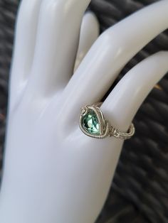 Green faceted crystal wire wrapped ring. Handmade with silver plated copper wire. Fall Wedding Planning, Crystal Wire Wrapped Ring, Silver Gift Wrap, Wire Wrapped Ring, Silver Ear Cuff, Wire Wrapped Rings, Crystal Ring, Purple Stones, Silver Gifts