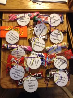 a table with some candy on it that is labeled in different languages and has been placed on top of each other