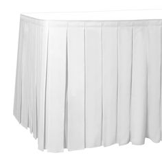 a white table skirt with pleated edges