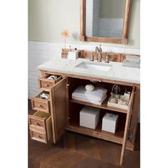 a bathroom vanity with two drawers and a mirror above it