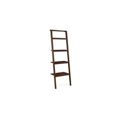 a wooden ladder shelf sitting on top of a white wall