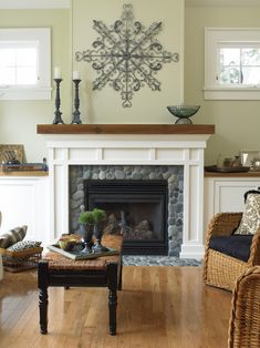 a living room filled with furniture and a fire place under a clock mounted on the wall