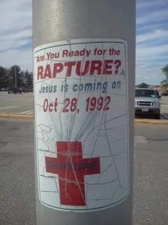 a sign on a pole that says are you ready for the rapture? jesus is coming or oct 28, 1932