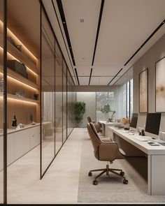 an office with glass walls and desks