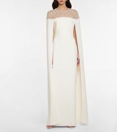 Bridal embellished crêpe cape gown in white - Safiyaa | Mytheresa Simple Cape Wedding Dress, White And Gold Cape Dress, Drape Cape Wedding Dress, Luxury Off-white Dress With Cutdana, Civil Wedding Dress Cape, Flare Cape Dress, Queen Freya Dress, Bride Cape Dress, Cape Designs