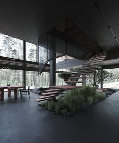 the interior of a modern house with stairs leading up to an outdoor dining table and benches