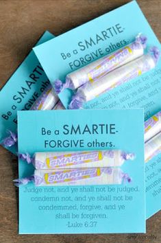 some candy bars are sitting on top of each other with the words be a smartie for