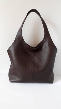 "This hand bag is crafted from textured soft leather in brown . It's the ideal size for taking you from desk to dinner, and can be worn over the shoulder for hands-free. - Two shoulder straps. - Pleated top with magnetic fastening. - You can choose from 8 leather colors. - Cotton lining with zip close compartment for securing your necessities, you can choose from 7 different linings. Free delivery is economic delivery. We use Latvian post and delivery can take 1-3 weeks in the EU, 3-4 weeks ever Brown Satchel Bucket Bag With Rolled Handles, Brown Satchel With Rolled Handles, Brown Textured Leather Hobo Tote Bag, Brown Leather Bucket Bag With Rolled Handles, Brown Textured Leather Hobo Shoulder Bag, Brown Textured Leather Hobo Bag With Double Handles, Brown Double Handle Hobo Bag With Rolled Handles, Leather Hobo Bag With Rolled Handles, Brown Hobo Bag With Soft Leather And Double Handle