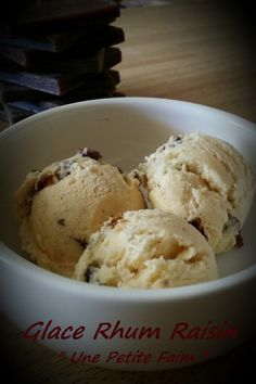 three scoops of ice cream in a white bowl