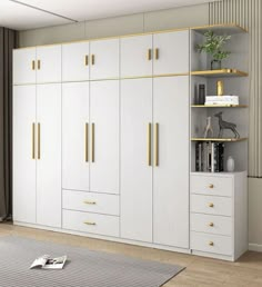 a living room with white cabinets and gold trimmings on the doors is shown