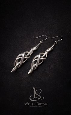 "Silver ELVEN Earrings - Art Nouveau , Boho, Celtic, dainty earrings, Dangle Earrings, Bridal earrings, Silver earrings, Wedding Earrings A long, light and beautifully crafted earring. Its form inspired by the craftsmanship and grace of the elven races we find in myths and fairytales. We really adore forms such as this one, where balance and harmony are so beautifully paired with complexity and detail. All of our jewelry are handcrafted by us. As we say, we became sculptors first and jewelers se Elven Earrings, Earrings Celtic, Nouveau Earrings, Fairy Costumes, Art Nouveau Earrings, Black Stone Earrings, Silver Bridal Earrings, Art Nouveau Earring, Elven Jewelry