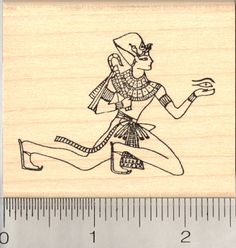 a rubber stamp with an egyptian woman running