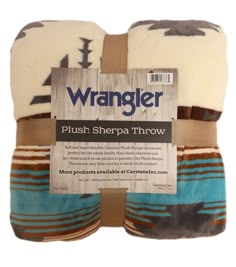 the wrangler plush sherpa throw is multicolored and has arrows on it