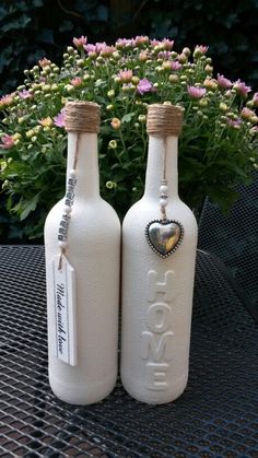 two white bottles sitting on top of a table