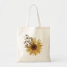 a canvas bag with an image of a sunflower and butterflies on the front that says, ollivia