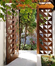 an open wooden door leading to a garden