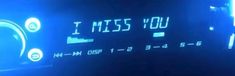 an alarm clock with the words i miss you written on it's display screen