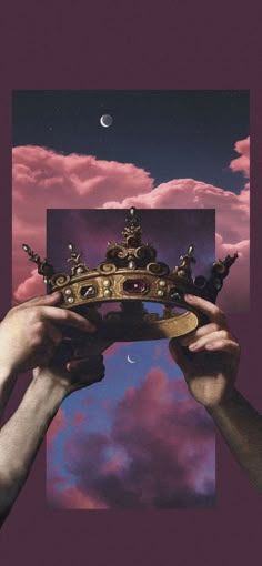 two hands holding up a crown in front of a purple sky with the moon behind them