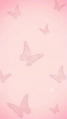 a pink background with many butterflies flying in the air