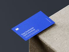 a blue business card sitting on top of a cement block with the words free business card microsoft