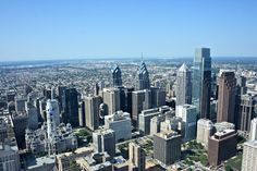 an aerial view of a city with skyscrapers and other tall buildings in the background