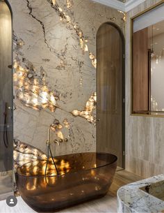 an elegant bathroom with marble walls and flooring