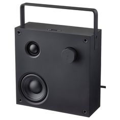 the speaker is black and has two speakers on each side, one with a handle