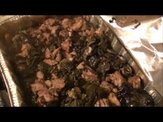 meat and vegetables cooking in an aluminum pan