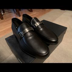 Made Of Iconic Saffiano Leather, These Loafers Are Characterized By The Logo On The Front Metal Tag. Upper: Saffiano Leather Logo Applied On The Enameled Metal Tag Upper With Apron Toe Rubber Sole Mens Prada 6. Made In Italy, Slip On, Smooth Calf Leather With The Bar On Top With Embedded Logo. This Is Unworn, New In The Box Designer Monk Strap Slip-on Shoes For Semi-formal Occasions, Designer Leather Monk Strap Shoes, Designer Leather-lined Monk Strap Slip-on Shoes, Designer Loafers With Leather Lining For Galas, Modern Calf Leather Loafers For Semi-formal Occasions, Luxury Business Casual Monk Strap Shoes With Removable Insole, Designer Monk Strap Slip-on Shoes In Calf Leather, Designer Monk Strap Shoes With Leather Sole, Luxury Leather Shoes For Business Casual With Removable Insole