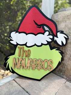 a sign that says the navaros with a santa's hat on it