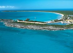 an island in the middle of blue water