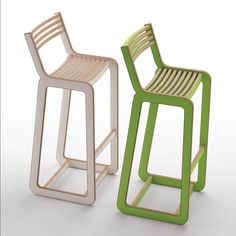 two different colored chairs sitting next to each other on a white surface and one is made out of wood