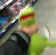 a blurry image of a person holding a tennis racquet in front of a store