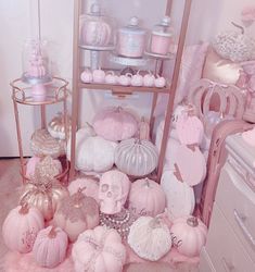 a room filled with lots of pink and white items on shelves next to a dresser